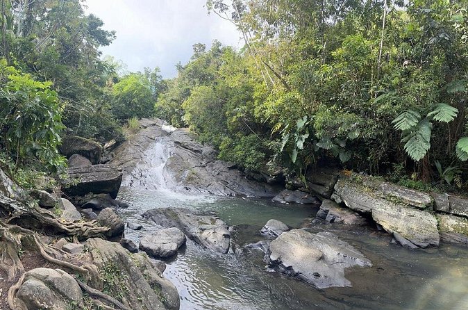 El Yunque & Beach Tour: Waterslide, Waterfall, Food, & Photos - What to pack for wet rocks and a beach stop