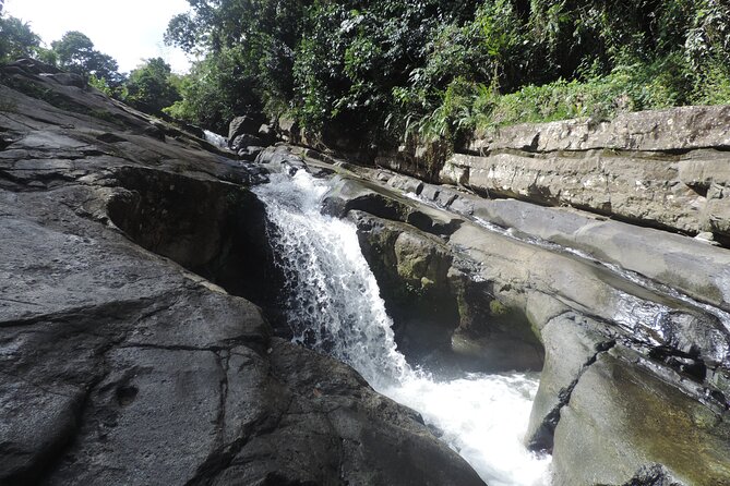 Half-Day Tour: El Yunque, Waterslides, and Luquillo Beach - Las Paylas turns the river into the main event