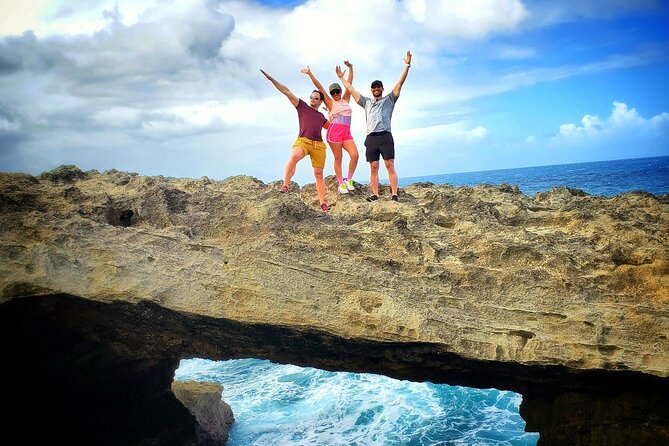 Private Rainforest Waterfalls and Beach Hiking Tour from San Juan - Reading the rocks at Playa Mar Chiquita