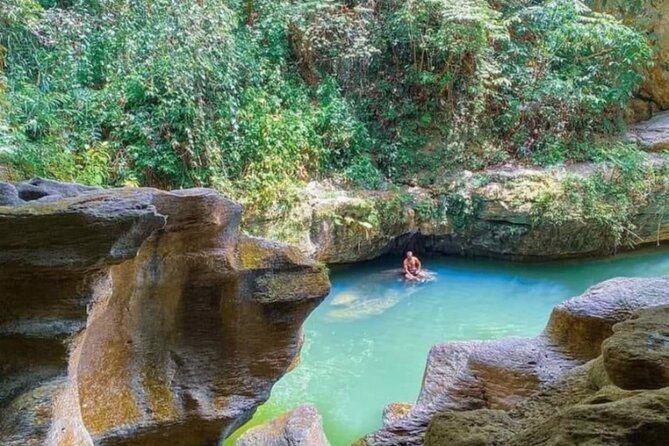 Rainforest Caves and Waterfalls Exploration with Transportation - Swimming in Charco Azul’s clear natural pool