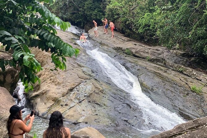 Rainforest Waterfall Slides/Adult Drinks included/ Beach - The cave and rainforest plants add more than scenery