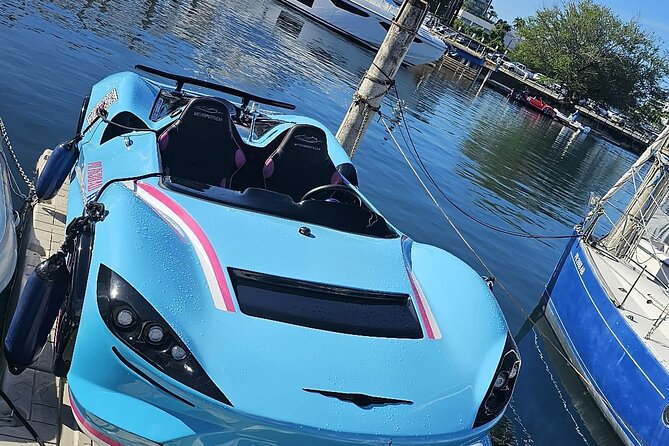 San Juan PR Watersports Car Rental Blue McLaren - Driving a blue McLaren across San Juan Bay