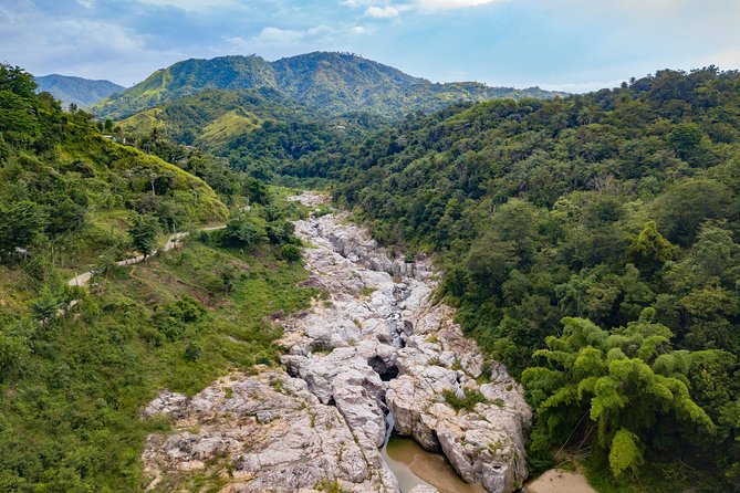 Utuado Canyon, River & Waterfall Adventure in Puerto Rico - The river trek to a protected swimming pool